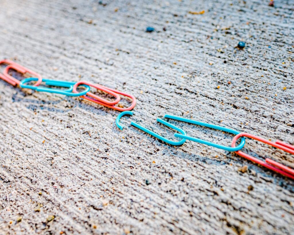 A broken colored paper clip chain